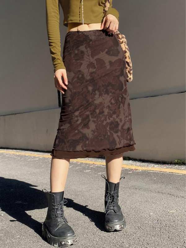 Earth Flower Midi Skirt has a mid rise waistline, a midi length fit, a mesh upper layer, a floral print all over and lettuce trim at the hem.