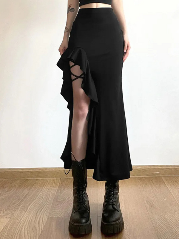 Waiting For The Night Midi Skirt. This midi skirt has a side slit with ruffled detailing, strappy thigh strappy design and a high waist fit.