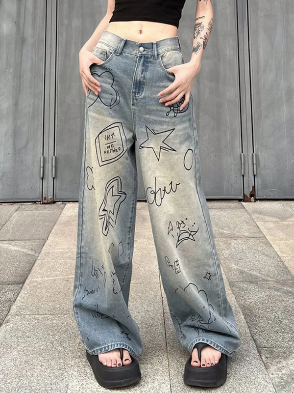 Express Yourself Graphic Jeans. These wide leg denim jeans have low waist fit, doodle graphics on the front and a buttoned zip closure.