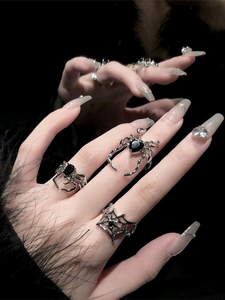 Into My Web Ring Set, enter if you dare. Be daring in this ring set that includes two spider shaped rings and one spider web shaped ring. All the rings are resizable. 