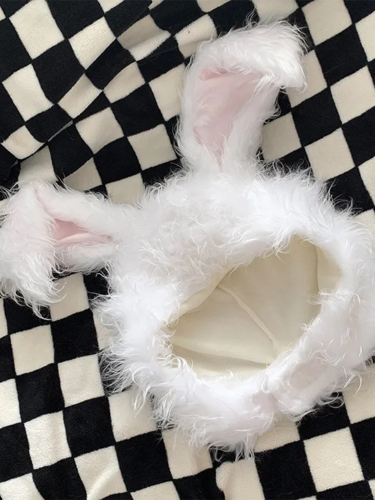 Hop To It Bunny Ears Hat. This rabbit ear hat has a fluffy faux fur construction and a chin strap closure.