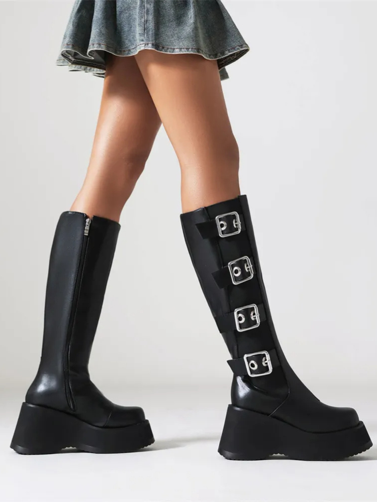 Got Me In Knee High Boots. These high knee boots have a vegan leather construction, platform soles, side zip closures, and buckle strap details all over.