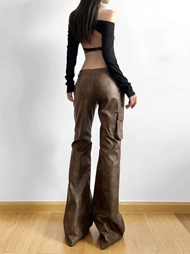 Ready For Work Cargo Pants. These flare pants come in a vegan leather construction, with a low waist, cargo pockets and a button zip closure.