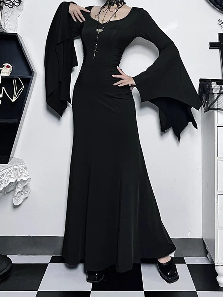 Witchy Energy Maxi Dress. This maxi dress has a stretchy construction, ruched sides and bat design bell sleeves.