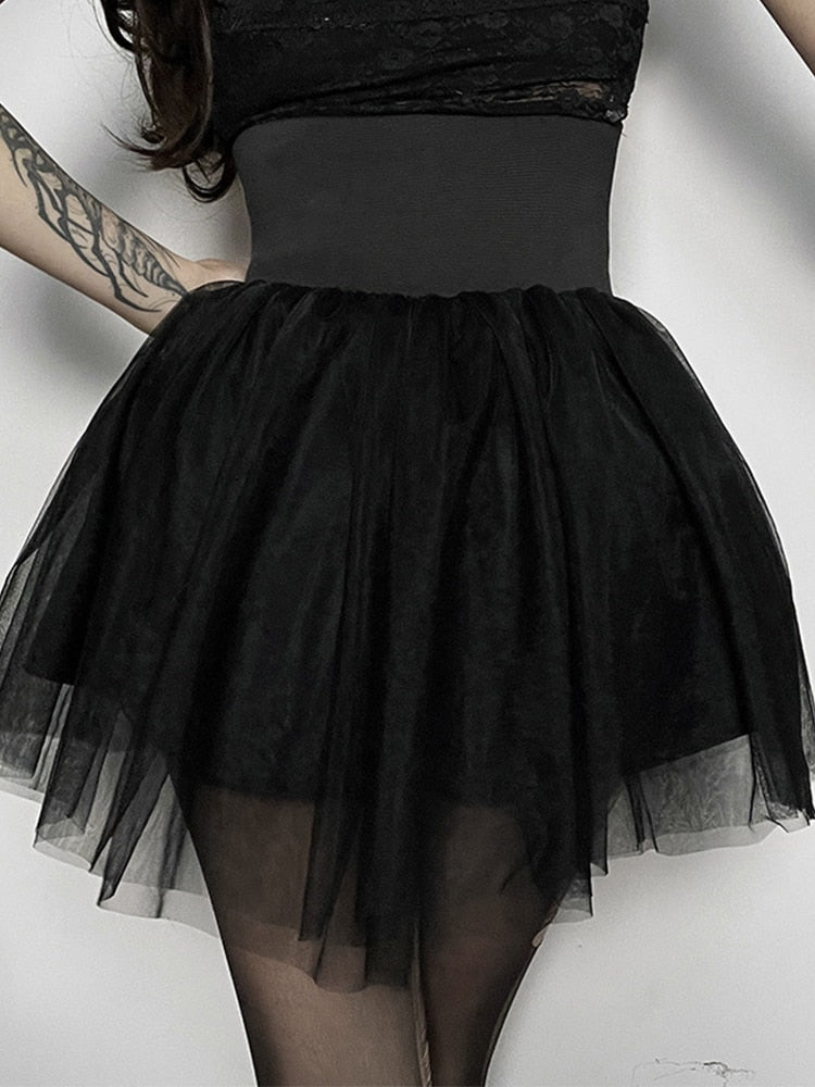 Sin In Disguise Tulle Skirt. This mini skirt features a layered tulle overlay and an elastic waist corset with hook and eye details.