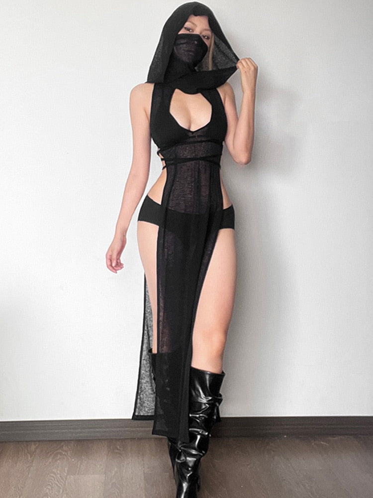 Cut The Atmosphere Hooded Maxi Dress. This maxi dress has semi-sheer construction, integrated mask and draped hood, high side slits with a lace up design on the sides with adjustable wrap-around waist ties.