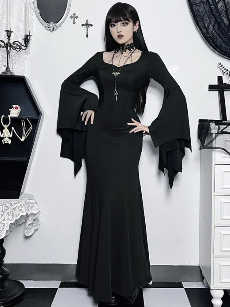 Witchy Energy Maxi Dress. This maxi dress has a stretchy construction, ruched sides and bat design bell sleeves.