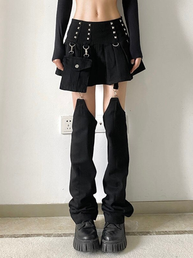 Problem Child Skirt Pants. This mini skirt has stud and D-ring detailing, detachable side pocket and garter straps with detachable pant legs.