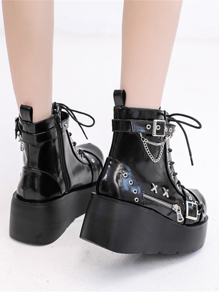 Heart Stealer Platform Boots. These patent boots have straps with eyelets and buckles, side zipper and dangling chains design, lace up fronts, platform sole, and side zip closures.