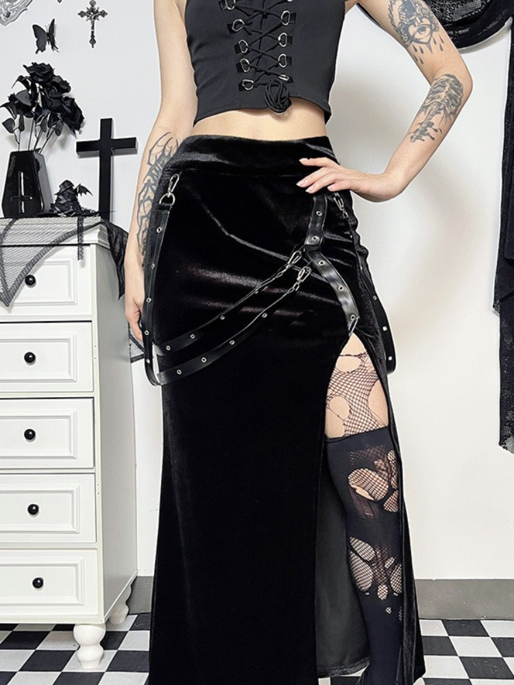 Black Aura Maxi Skirt. This maxi skirt has velvet construction, side slit, straps with eyelet details and a back zip closure.