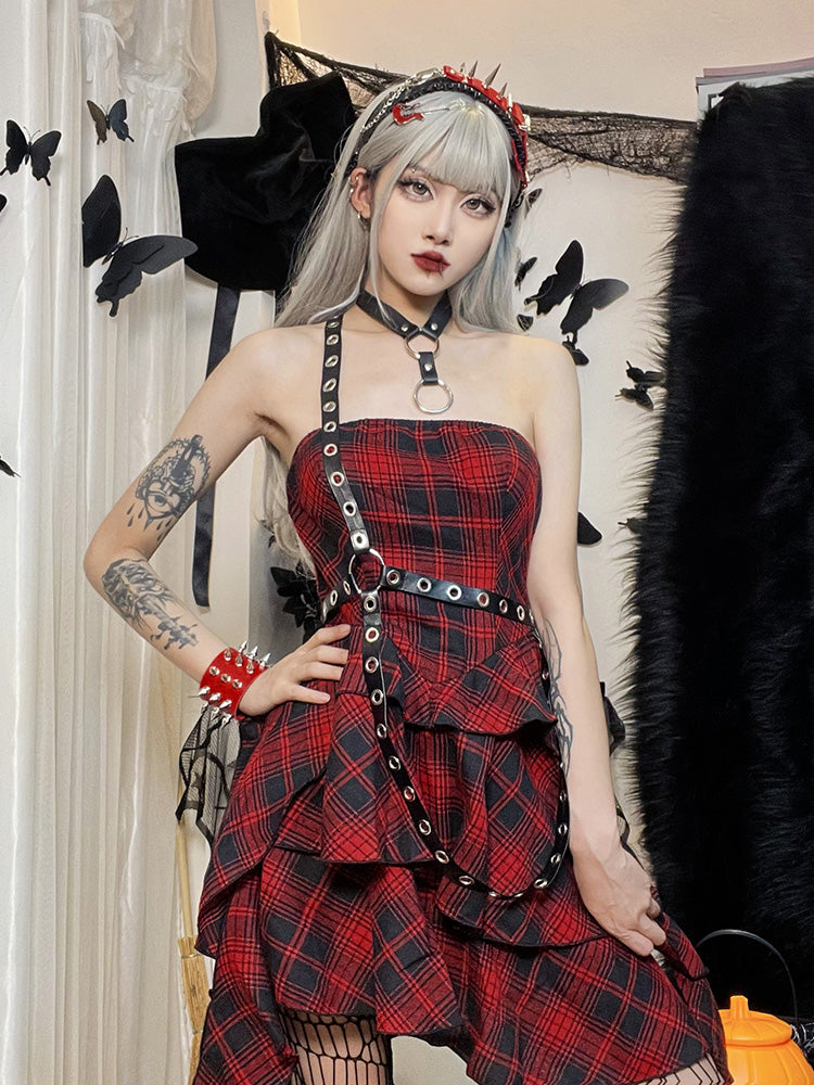 Pretty Rebel Plaid Dress. This mini dress has a plaid pattern design, a body harness with eyelet accents and a handkerchief detail hem.