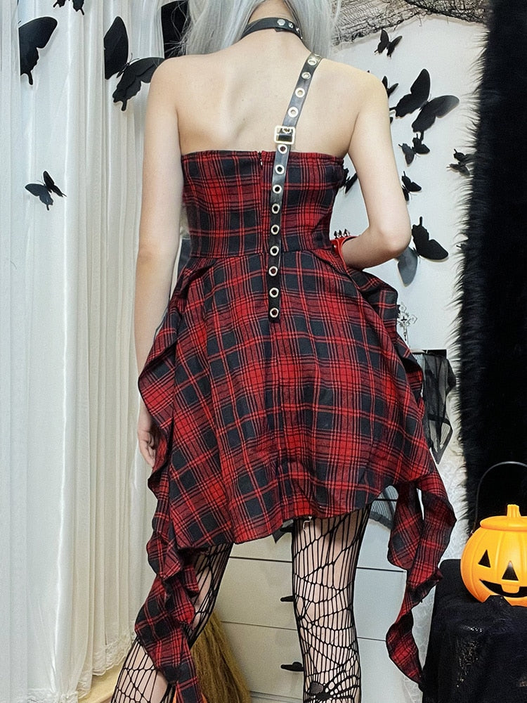 Pretty Rebel Plaid Dress. This mini dress has a plaid pattern design, a body harness with eyelet accents and a handkerchief detail hem.