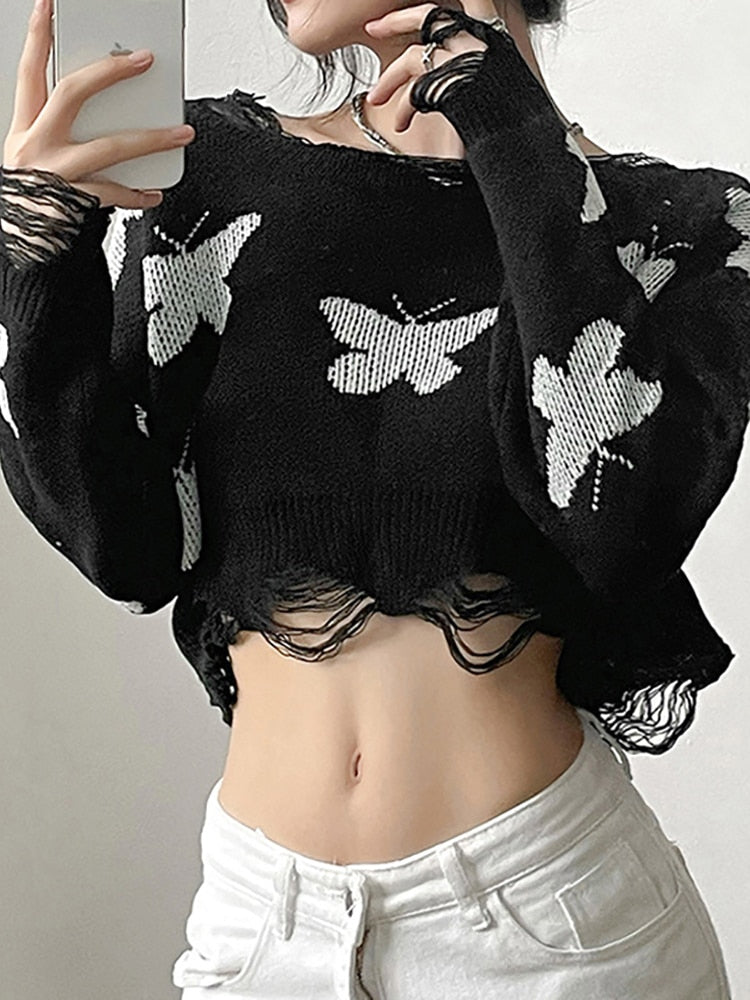 On The Fly Distressed Sweater. This long sleeve knit sweater has a cropped fit, a distressed design and butterflies print all over.