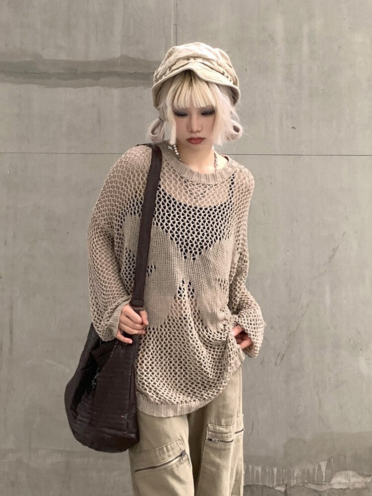 Butterfly Effect Oversized Sweater cuz you've got wings. This sweater has a loose knit fishnet construction, long sleeves, a crew neckline and a butterfly graphic on the front.