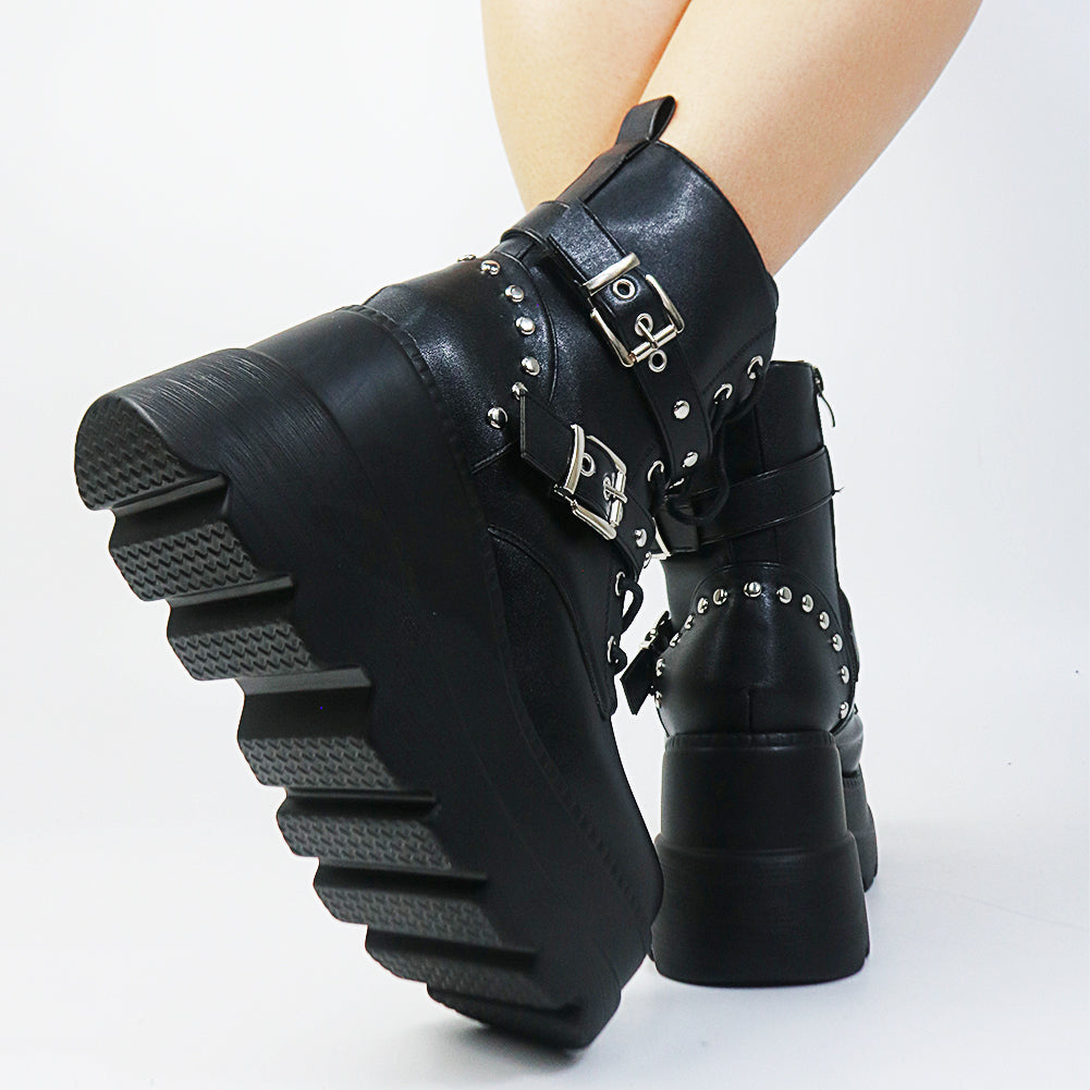 Heartless Ankle Platform Boots feature a vegan leather construction, front lace up closures, double buckle straps and platform soles.