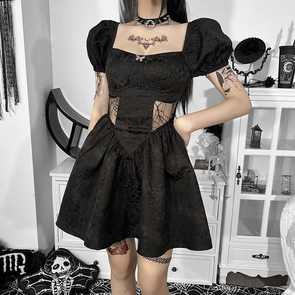 Wicked Butterfly Puff Sleeve Dress. This wicked babydoll dress has a lil butterfly on the front, floral pattern construction all over, side web mesh panels, short puff sleeves and a back zip closure.