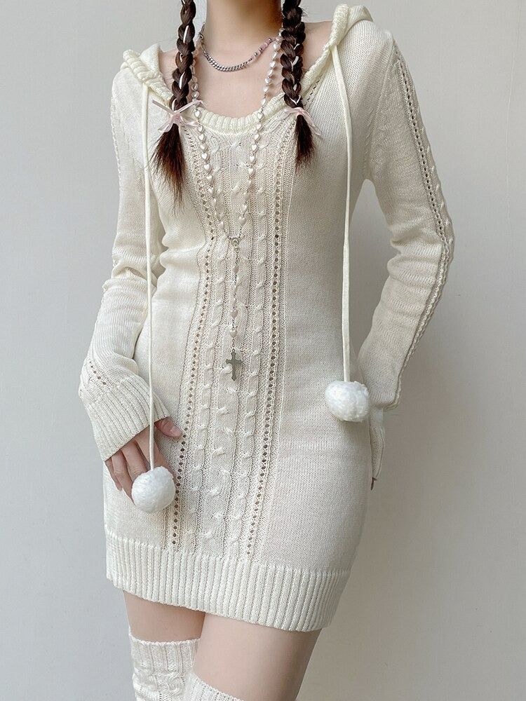 Cuddle Weather Knit Hoodie Dress. This snuggly long sleeve sweater dress has a bodycon fit, a warm knit construction, a hoodie and drawstrings with pom poms.